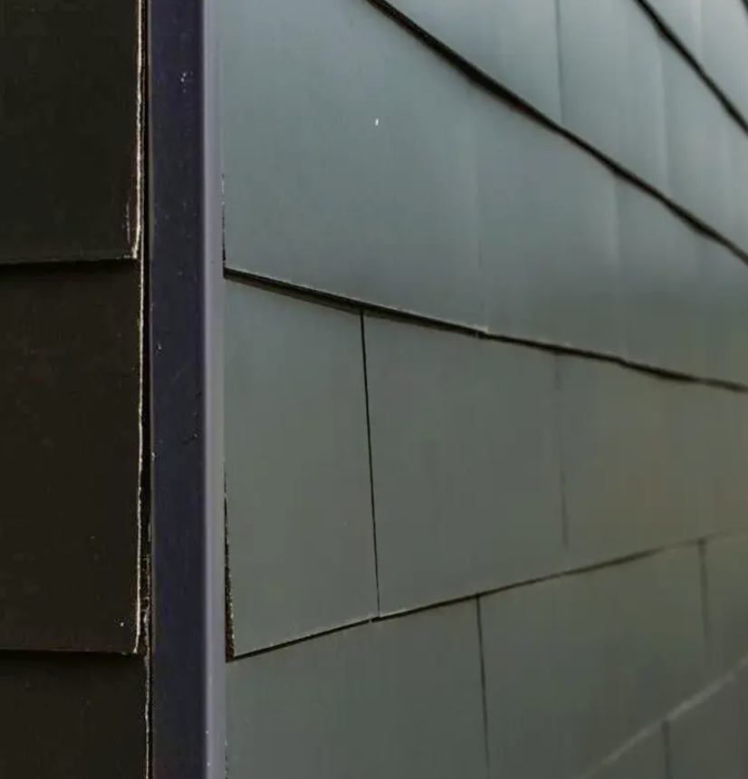 Le bardage : une solution esthétique et durable pour votre maison 3 bardage en ardoise artificielle d'une maison